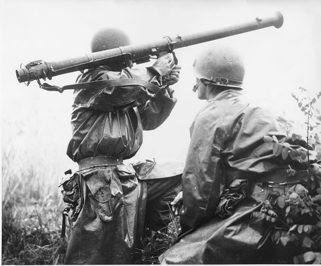 Moments before his death, Shadrick (right) looks on as another soldier fires a bazooka.
